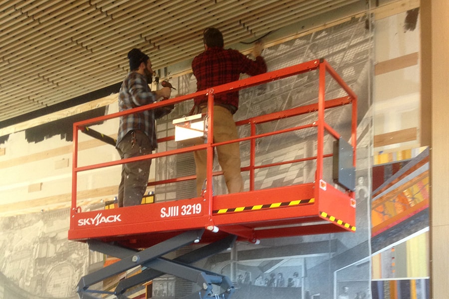 Mtich and Seth on scissors lift