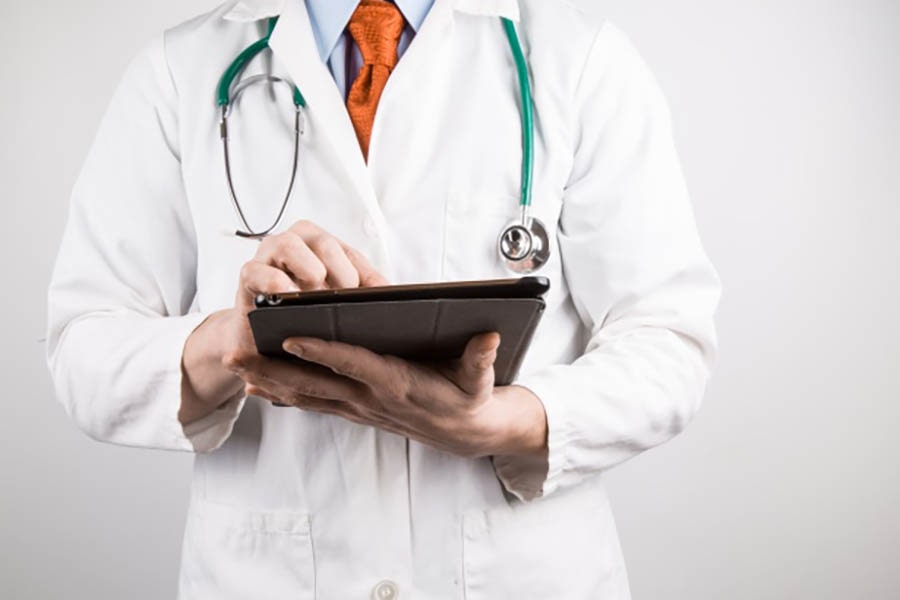 image of a doctor with a tablet computer