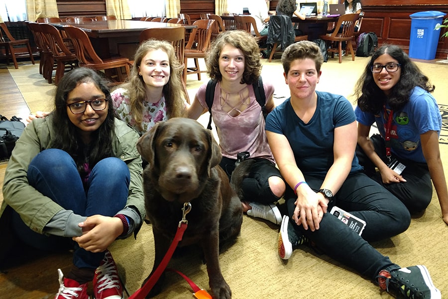 image of Larsen's dog, Mudge, with students