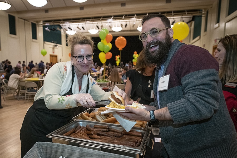 image of Rebecca Doerge and Adam Causgrove at the buffet line