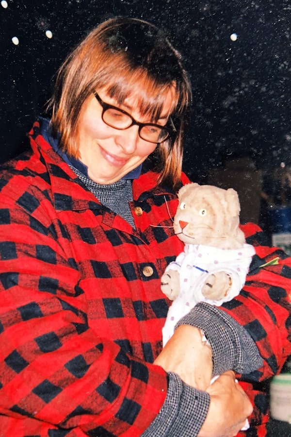 Image of Kathy Borland holding Daniel Tiger