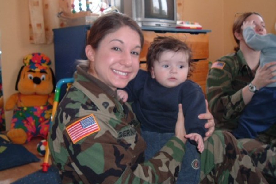 image of Richelle Bernazzoli holding a child at an orphanage in Kosovo