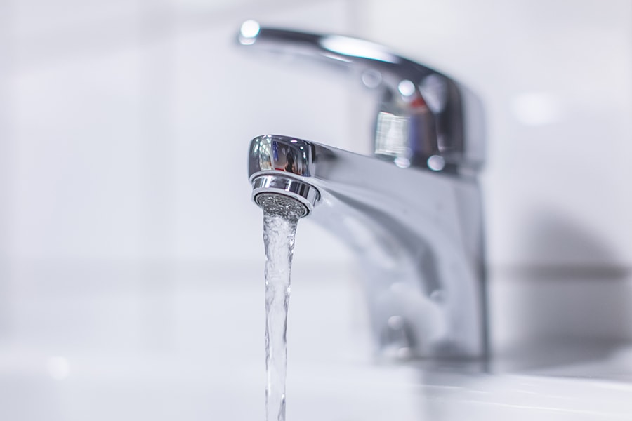 Image of a faucet with running water