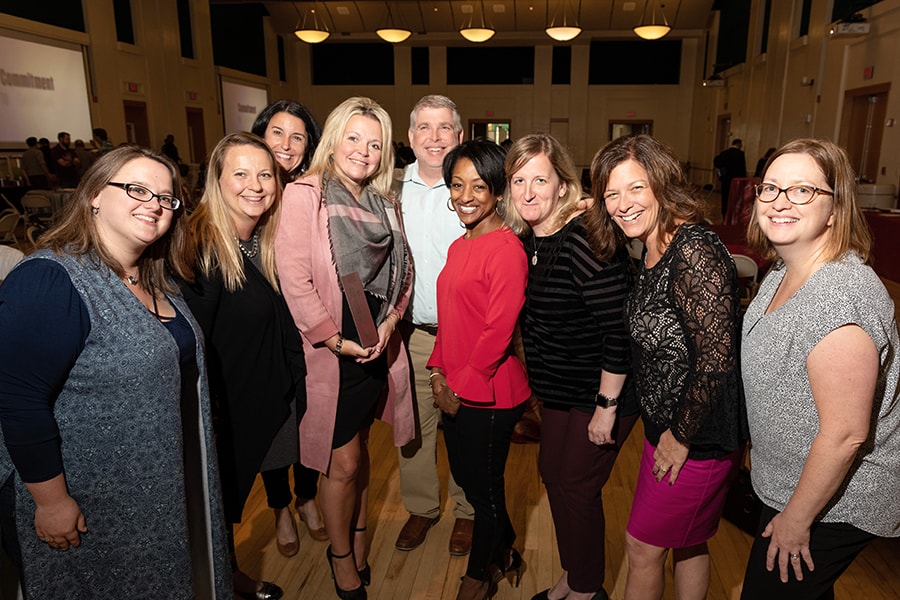 image of Carrie Nelson with colleagues