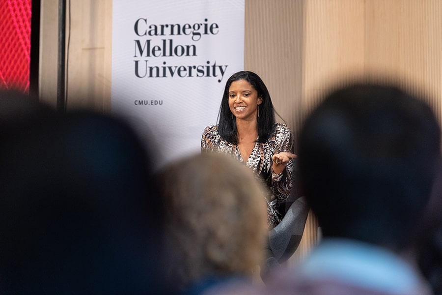 closeup of Renee Elise Goldsberry with students in the foreground