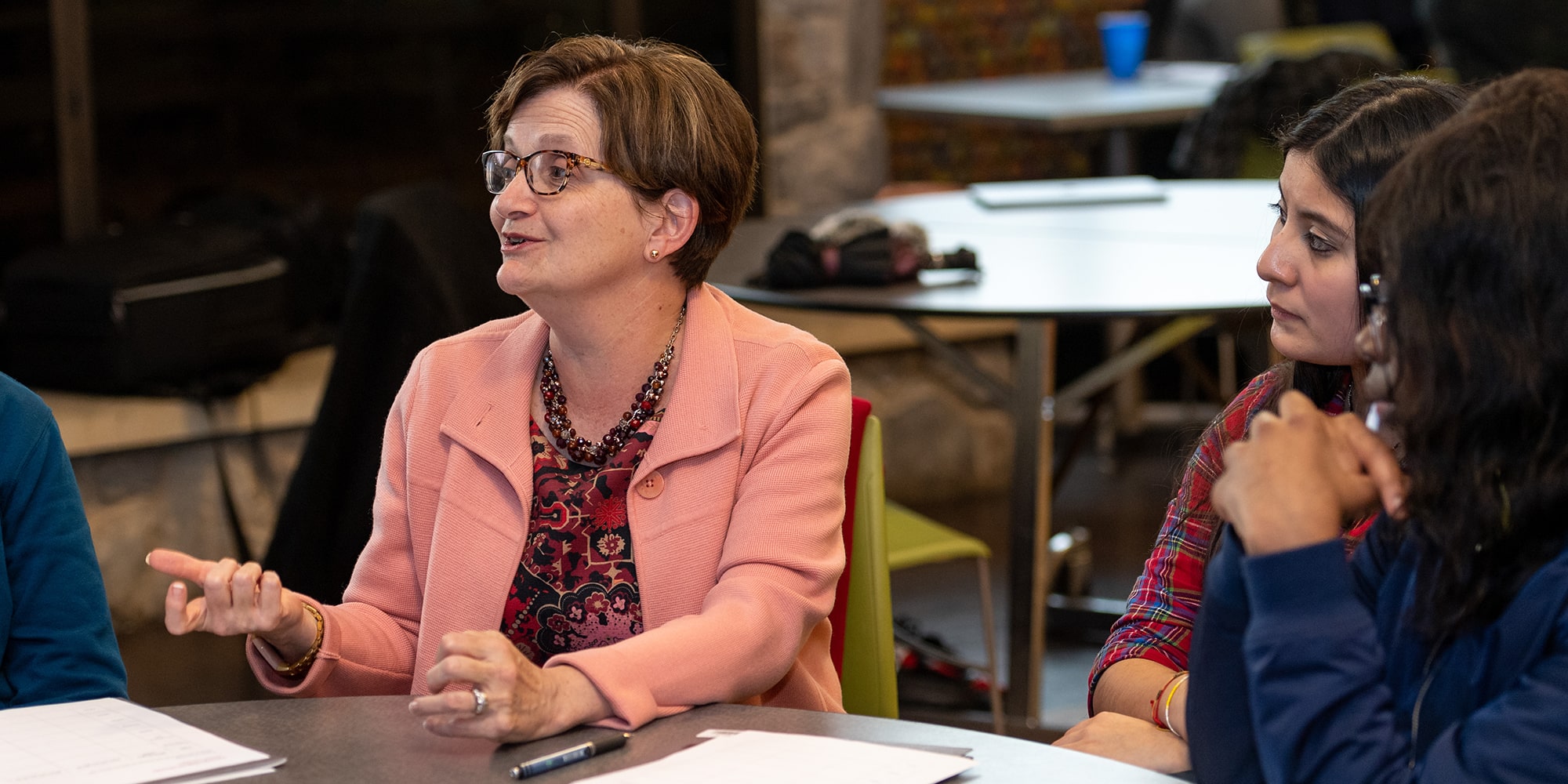 image of Amy Burkert talking with students