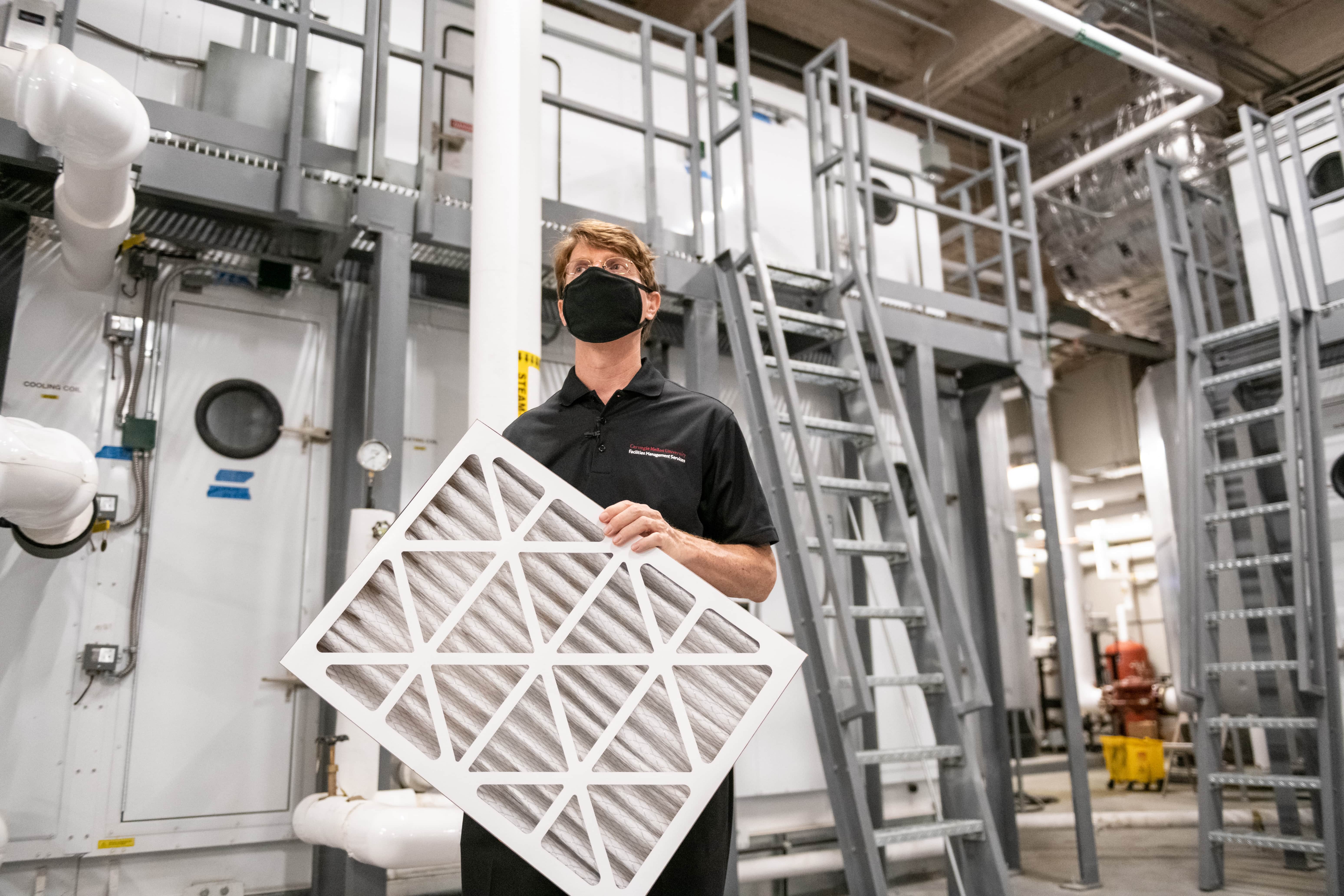 Steve Guenther holding an air filter