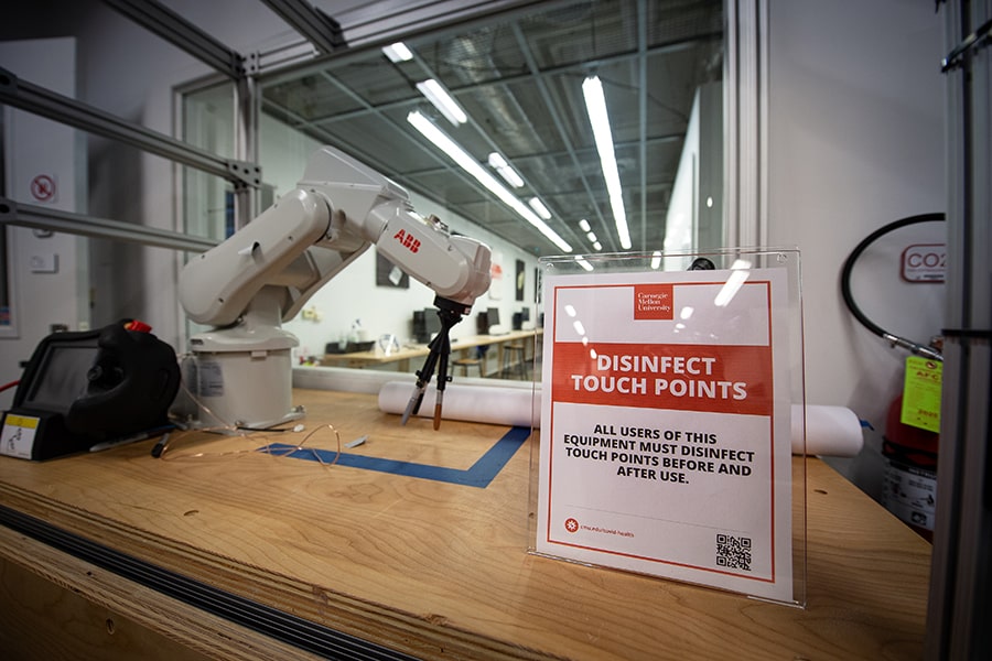 image of a disinfect touch points sign in a lab