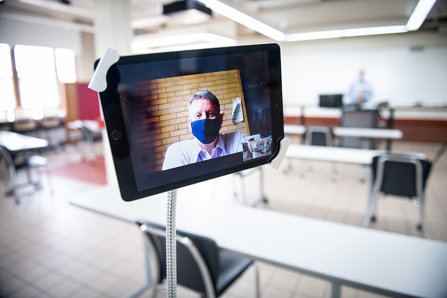 image of a classroom in which the professor is on a computer screen