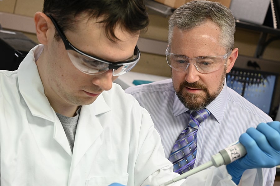 image of a student and professor in a biology lab