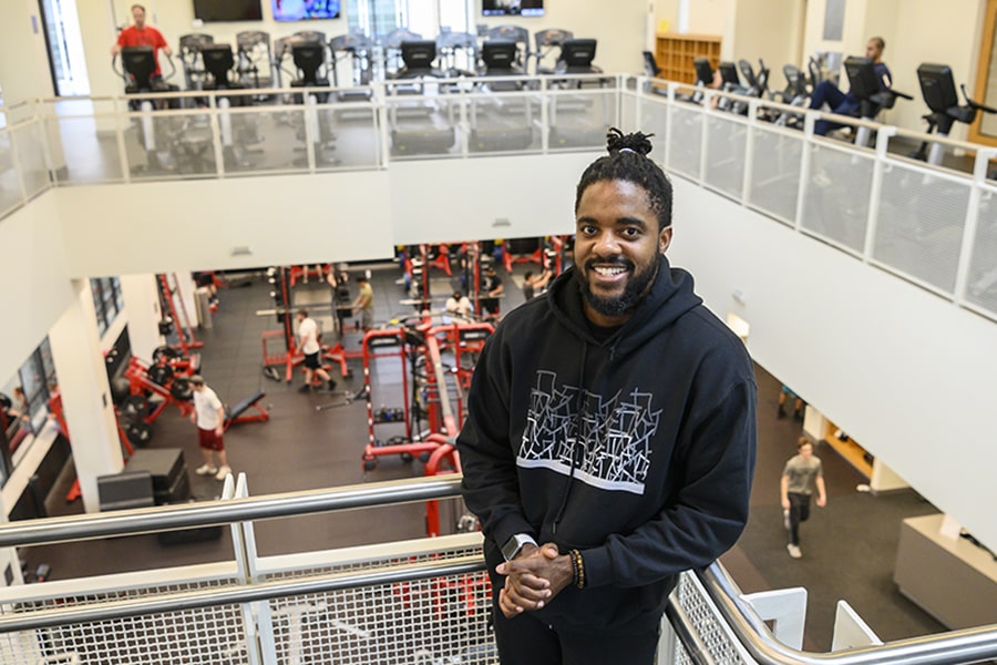 image of Nate Frezzell in Cohon University Center with gym in background
