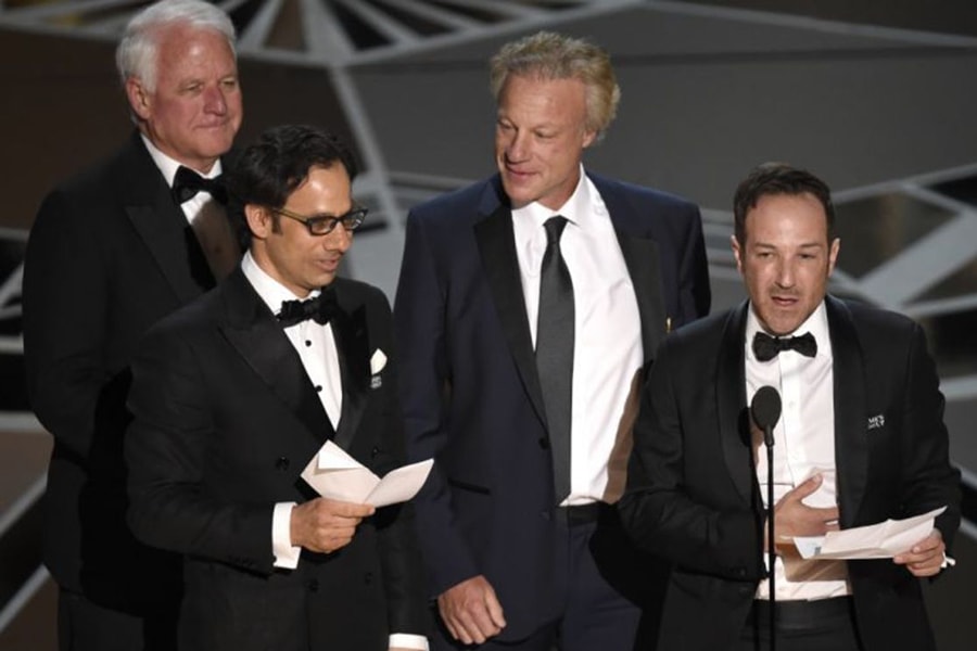 image of Jim Swartz and colleagues accepting an Oscar