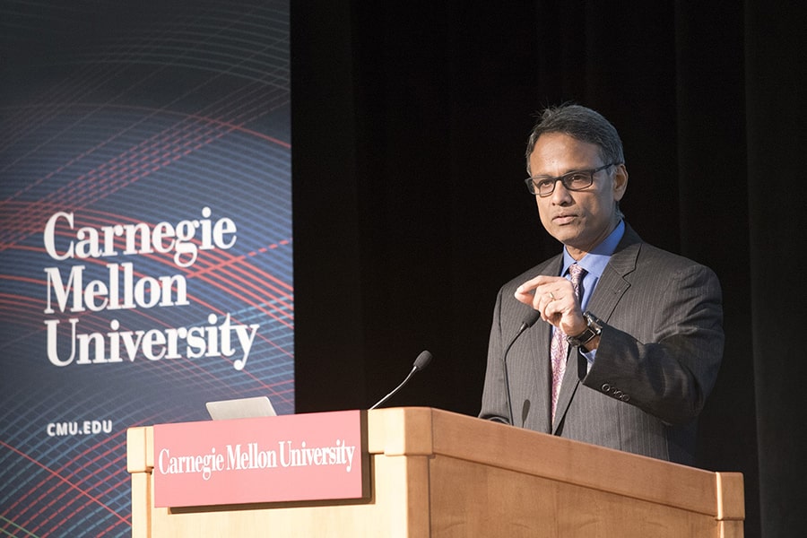 image of Ramayya Krishnan speaking from the podium at a CMU event