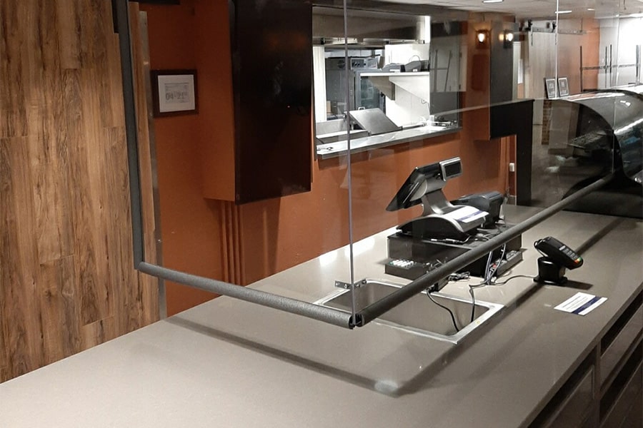 Image of plexiglass at cashier station in The Underground