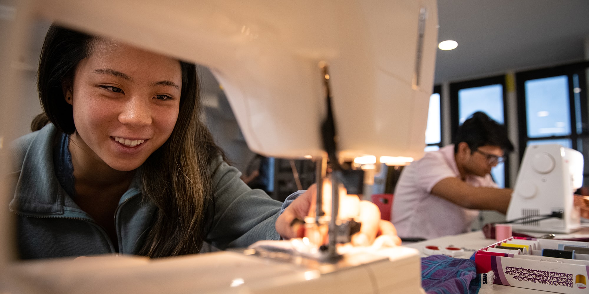 image of student using a sewing machine in the Morewood Gardens Maker Space