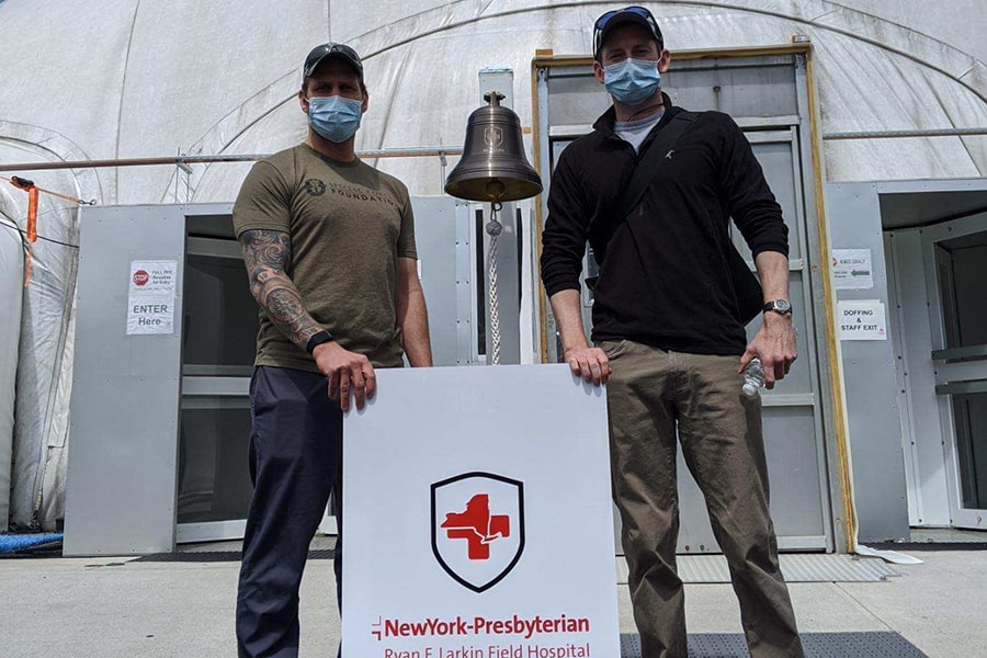 image of Luke Sciulli, left, with fellow hospital volunteer Alex Scott outside Larkin Field Hospital in NYC