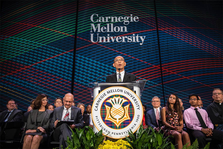 Conrad Zapanta speaking at the podium at a CMU event