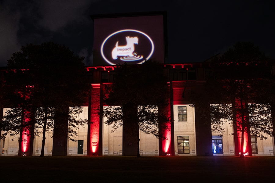 image of Purnell Center lit red