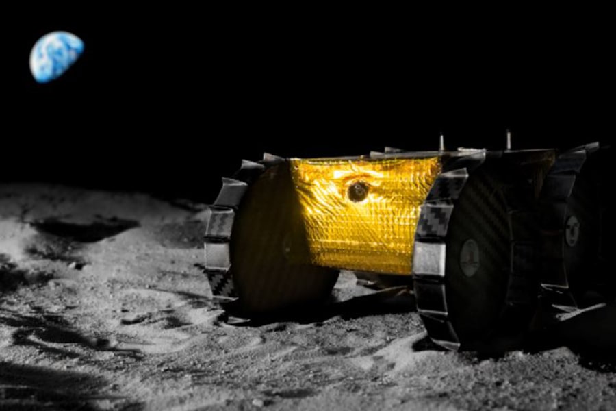 the iris rover with earth in the background