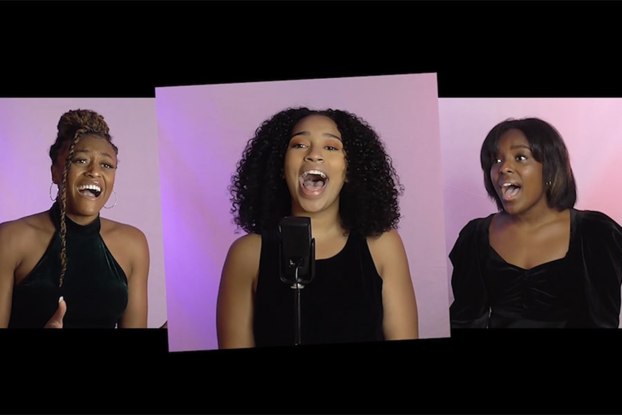 three female students singing