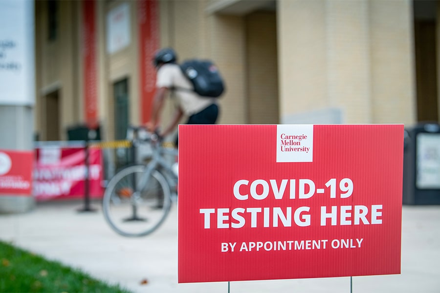 sign on campus says COVID-19 testing here