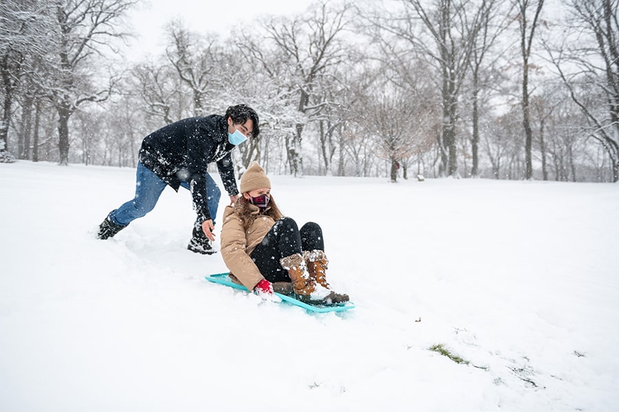 student traying on snowy hill