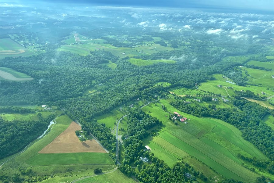 view of land from the air on a sunny day