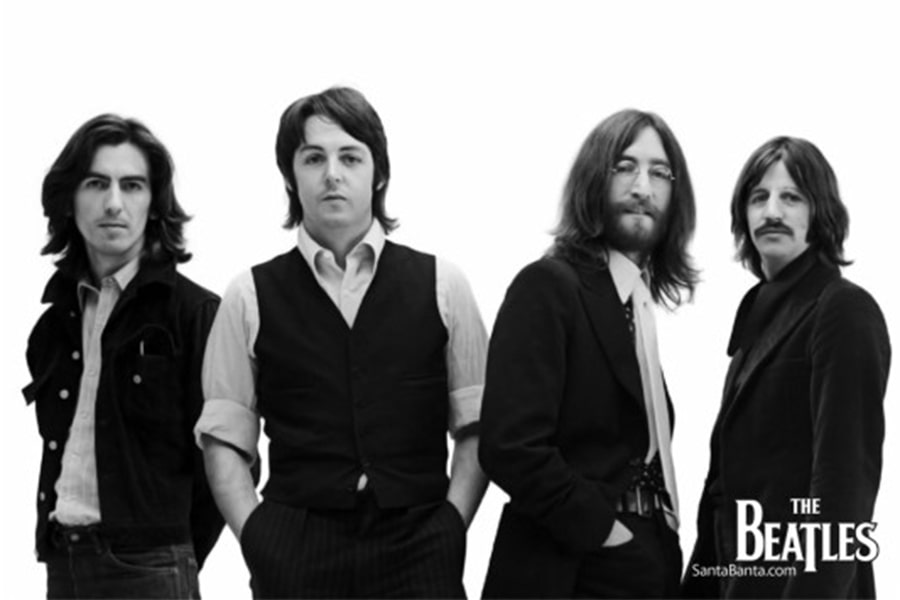 black and white image of The Beatles standing