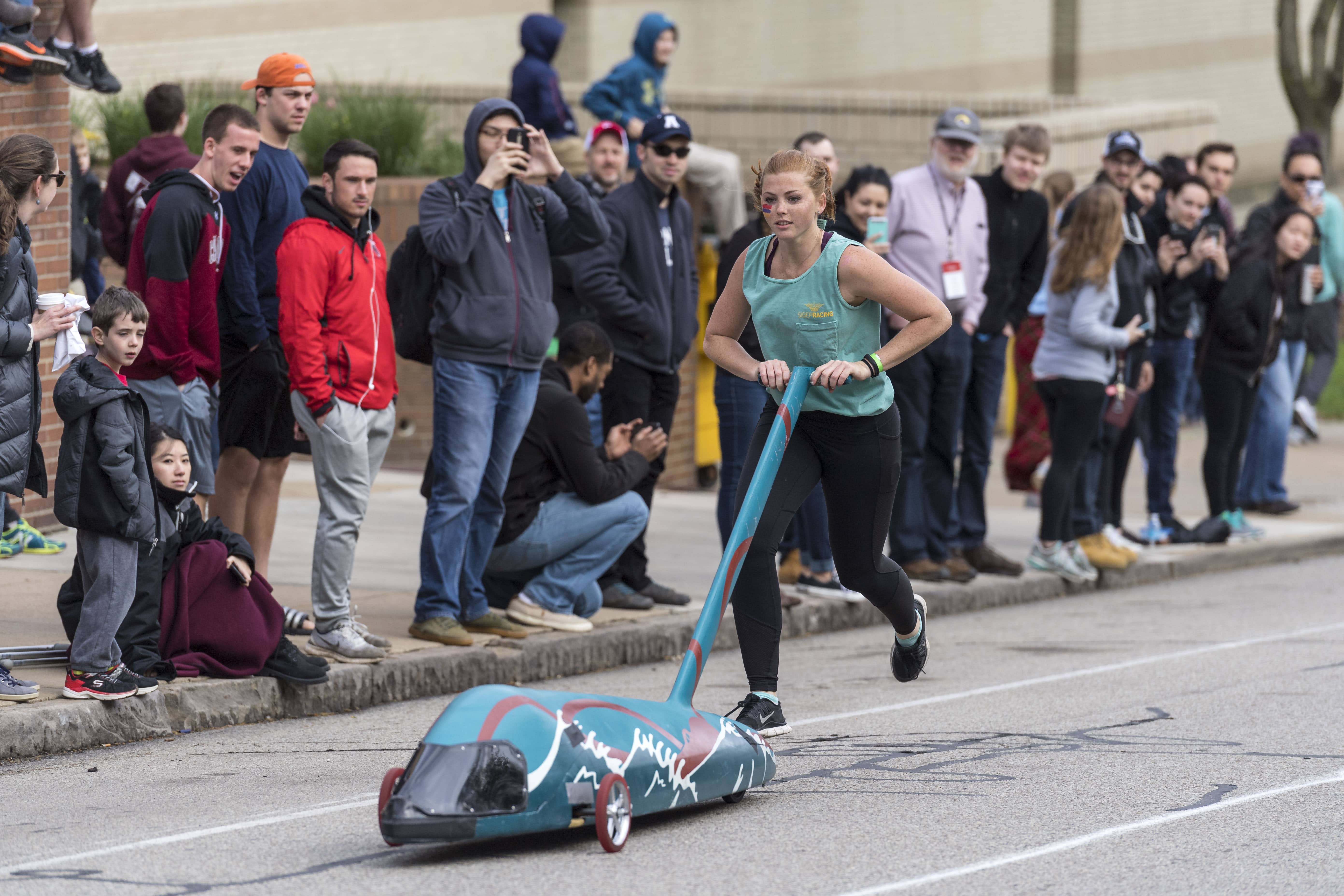 a student pushing a buggy