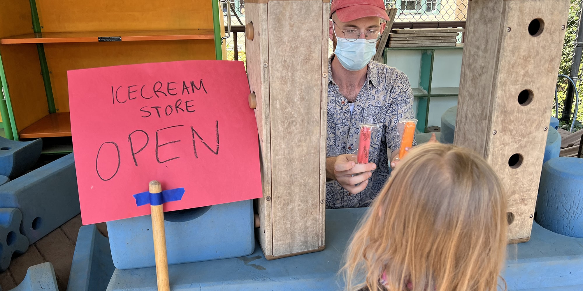 David Allen plays ice cream store with a student