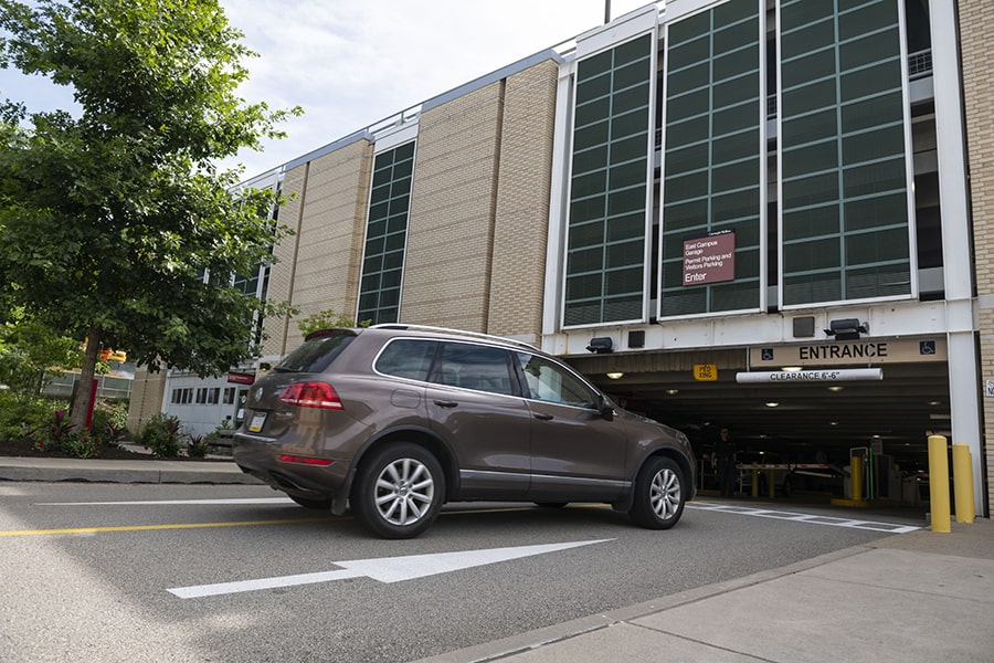 a car enters the East Campus parking garage