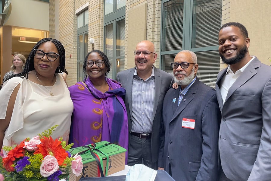 President Jahanian standing with Sankofa members