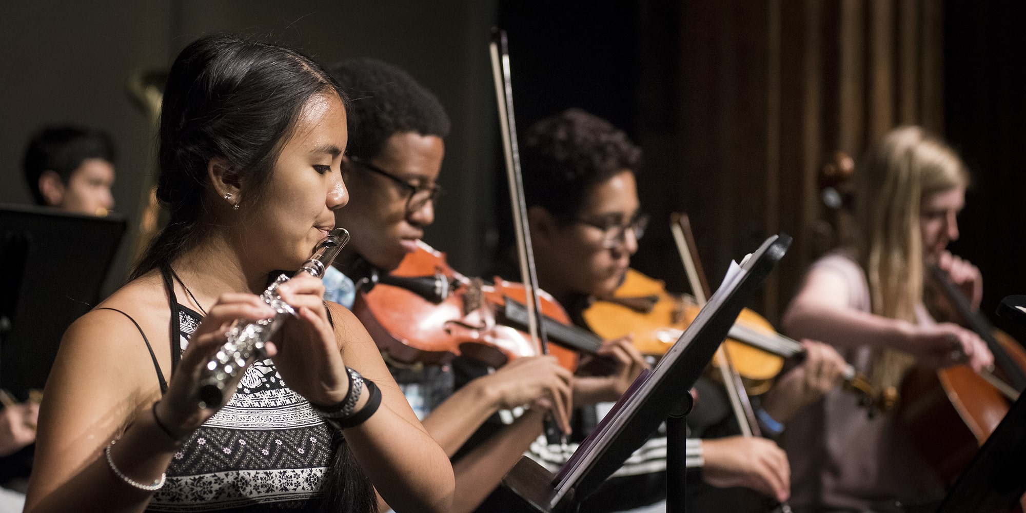 students playing in an orchestra