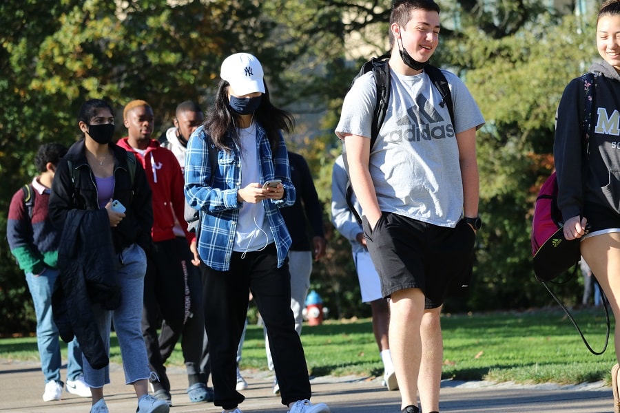 students walking across campus