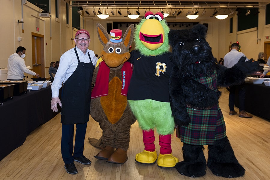 President Jahanian with mascots