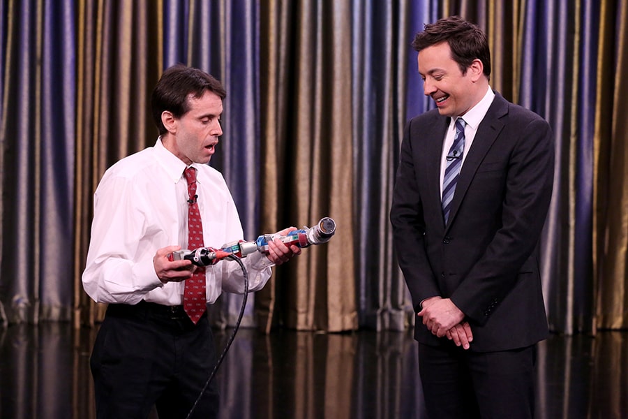 Howie Choset shows snakebot to Jimmy Fallon.