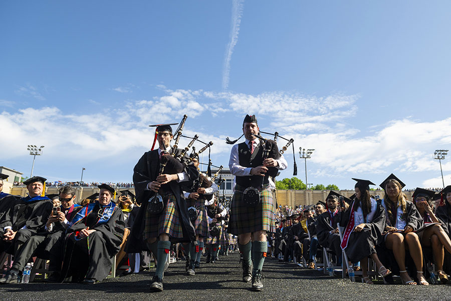 Bagpipers lead the procession at Commencement