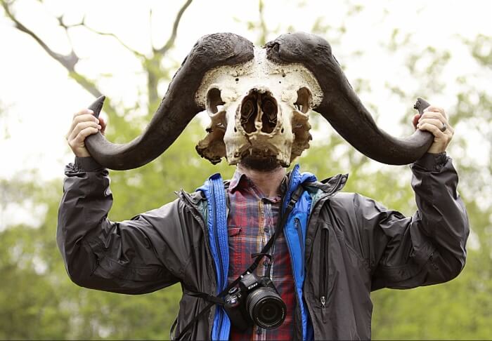 Jason Bittel holding an animal skull