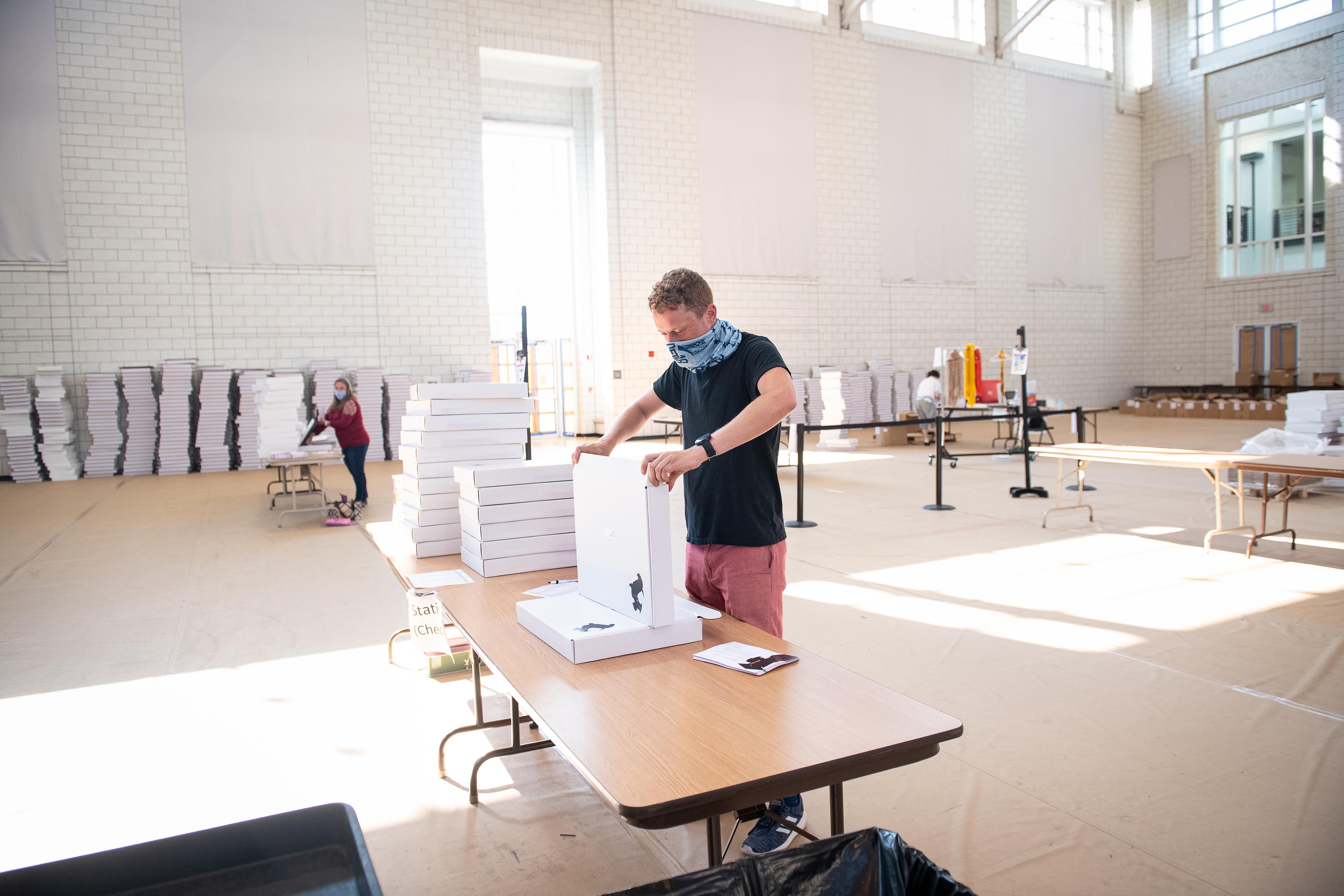 Image of Matt Stephens assembling a box