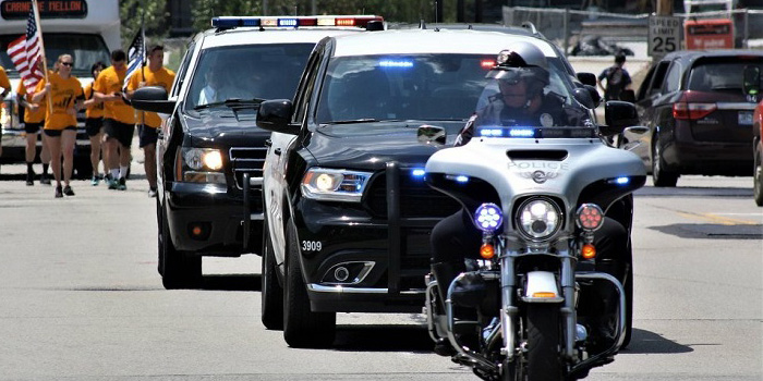 CMU police leading motorcade