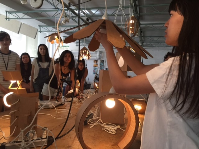 Design students working on lighting fixtures