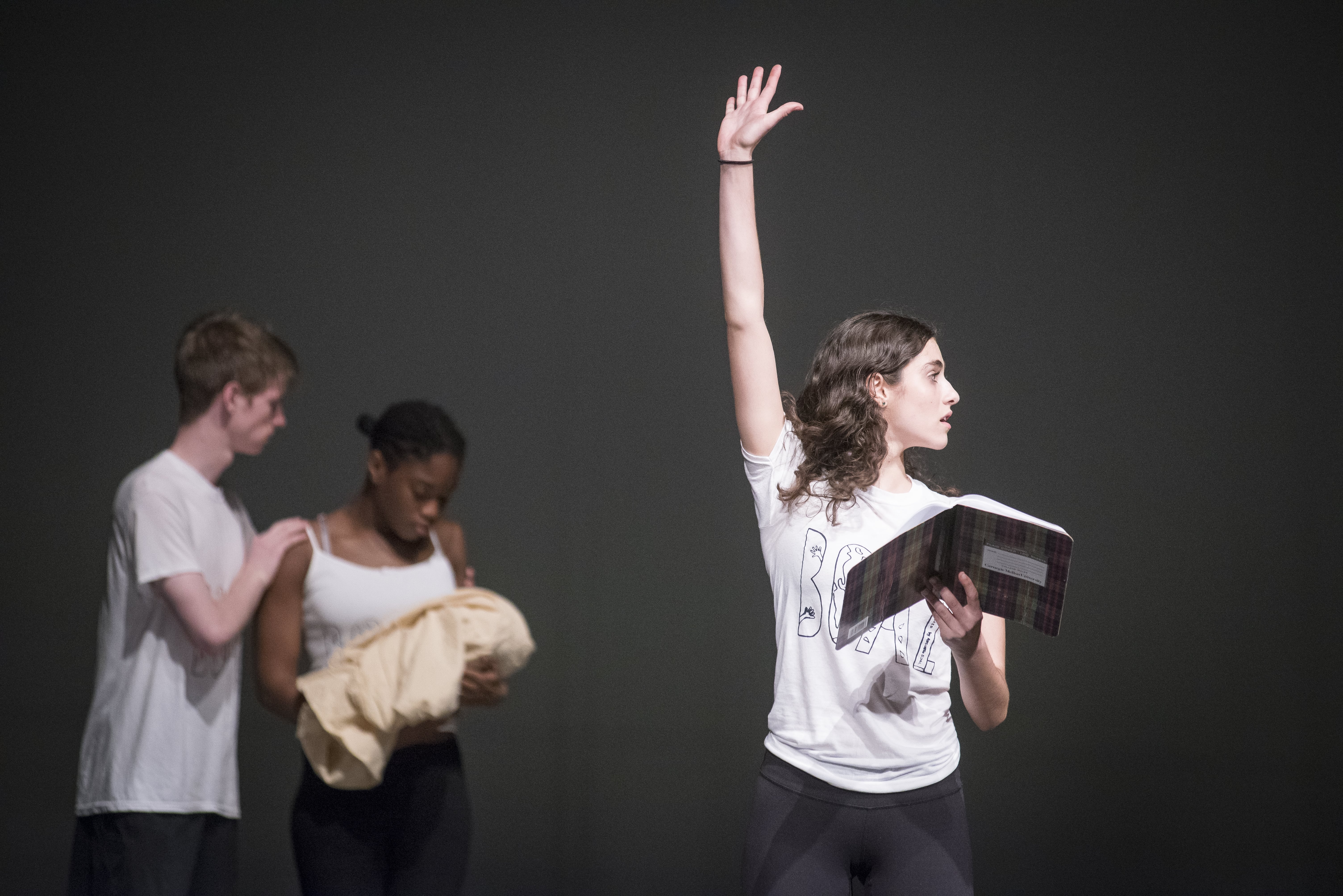 three drama students performing
