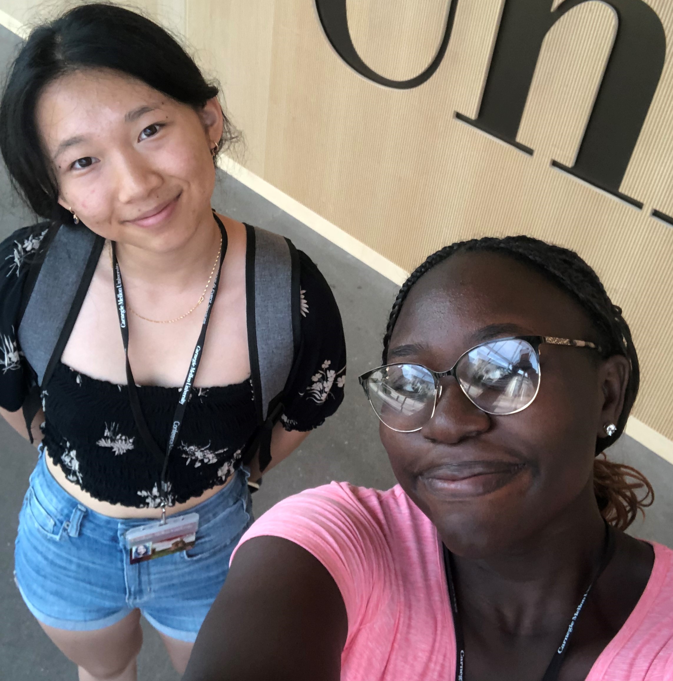 Pre-College students smiling at the camera.