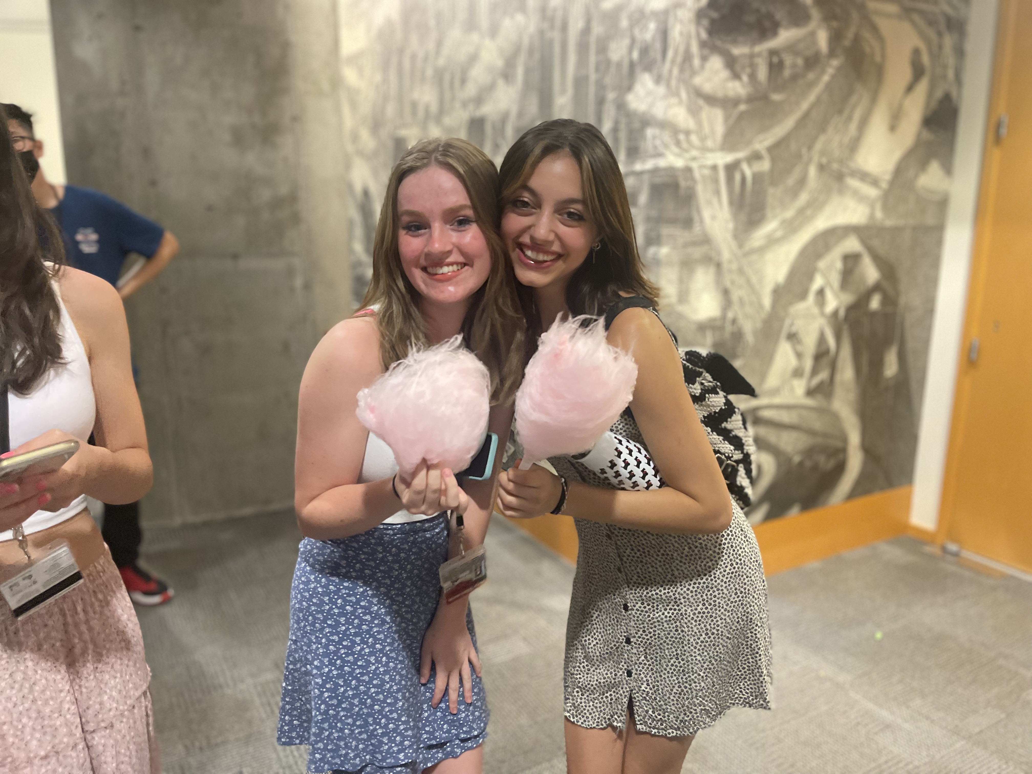 Pre-College students at dance party eating cotton candy.