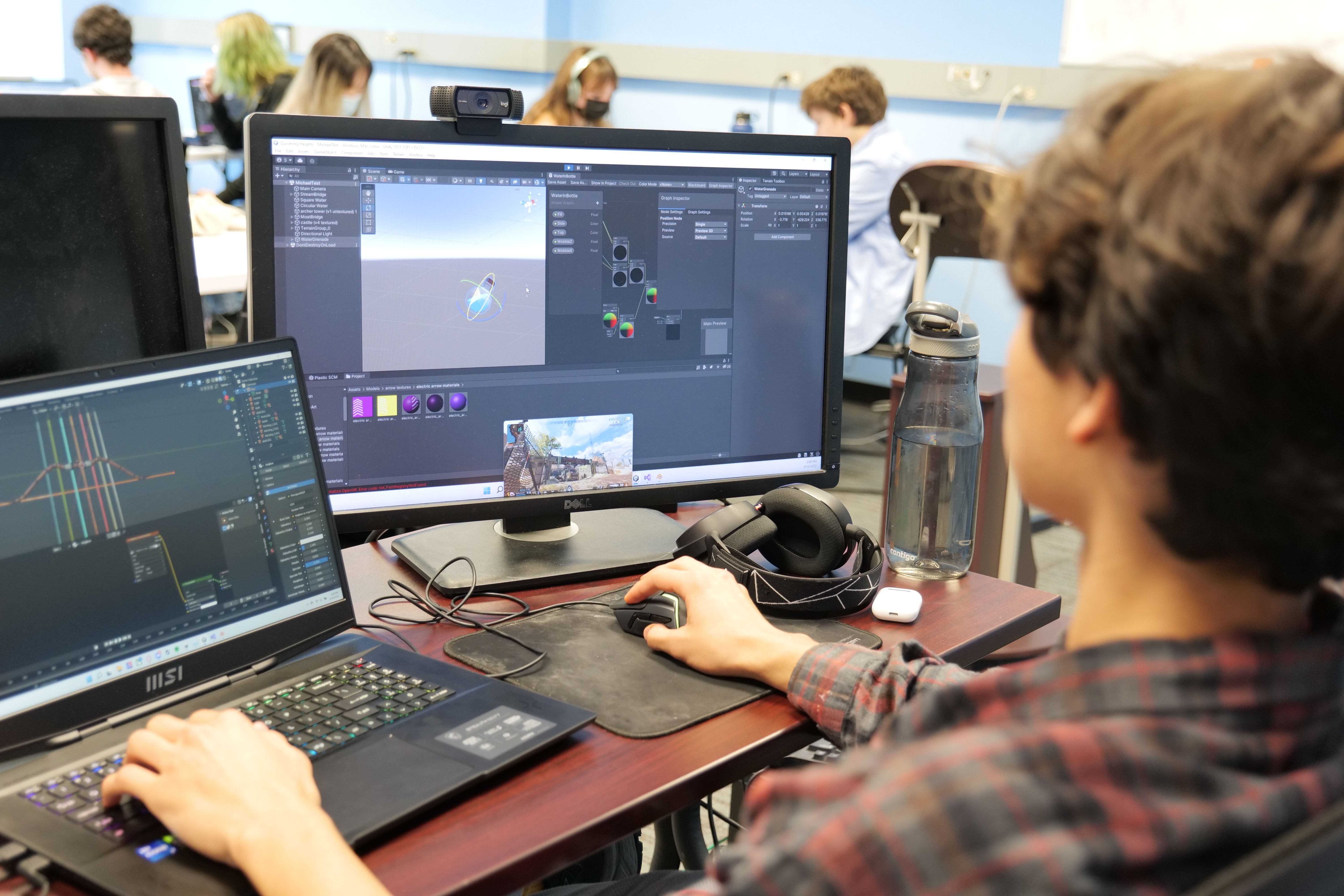 Students working at computer stations.