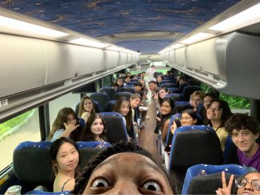 Students on a bus during an off-campus trip.