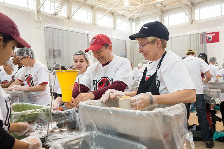 Faculty and staff volunteering during the Stop Hunger campaign