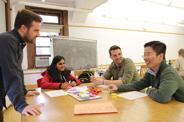 Graduate students collaborating in a classroom