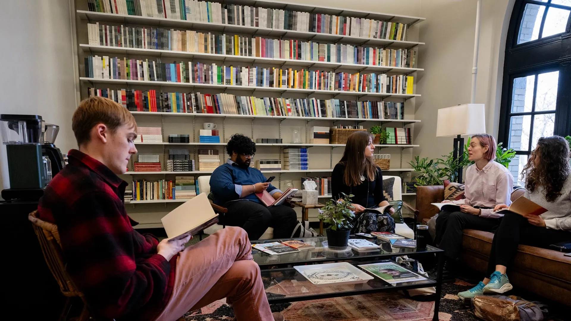Dietrich students gather in a room lined with books