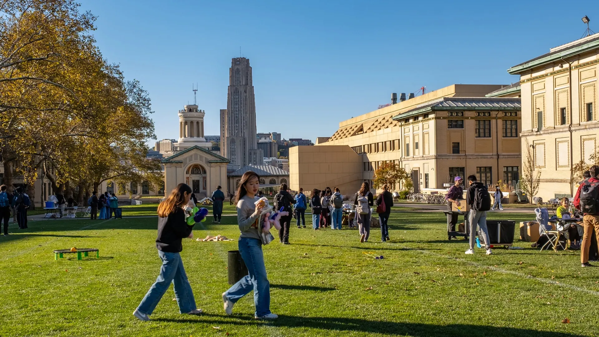 Two students walking across campus